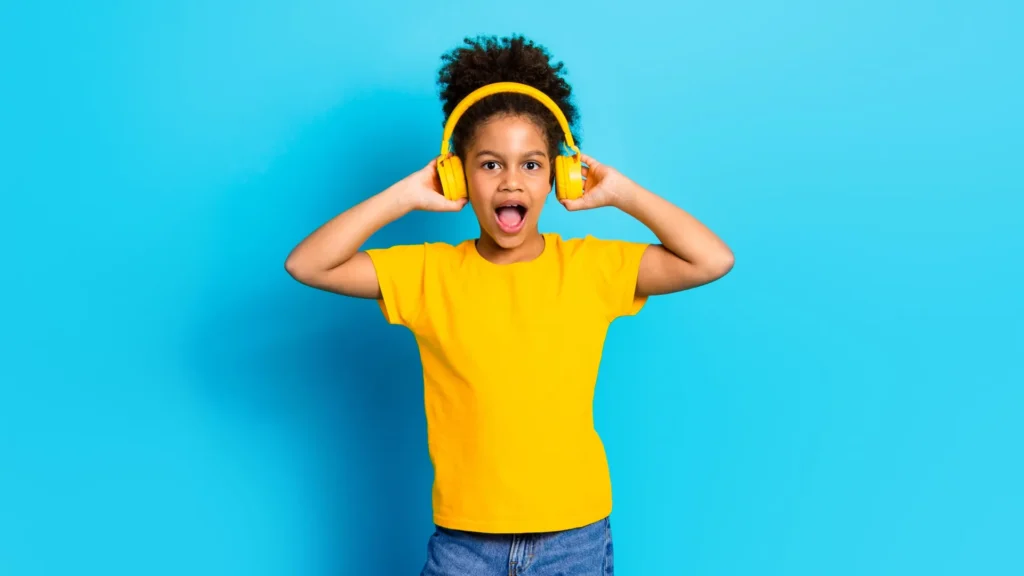 Learn about reveals bad lead ranges in kids’s clothes Girl Yellow Headphones T Shirt Jeans Close.webp 1024x576