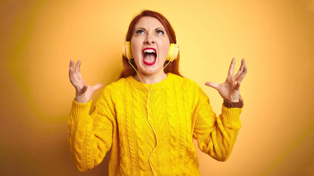 redhead woman screaming music headphones.webp.webp
