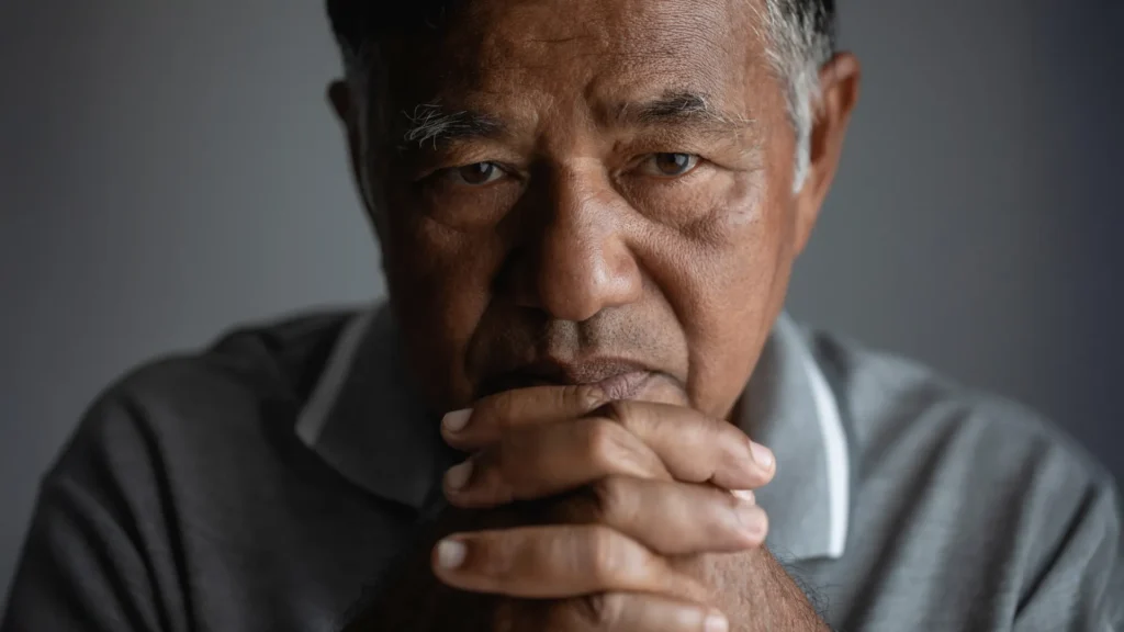 stressed sad senior asian man close up.webp.webp