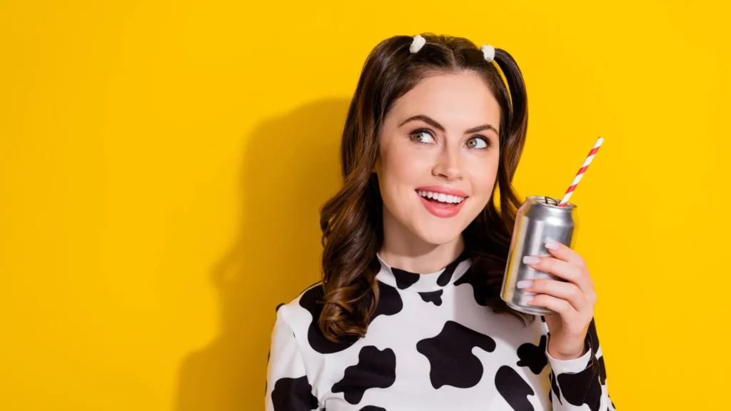 woman smiling holding diet cola.webp.webp