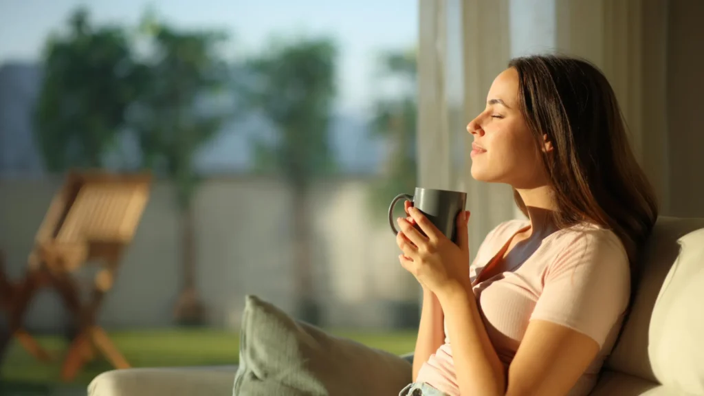 woman enjoying morning coffee and sunshine.webp.webp