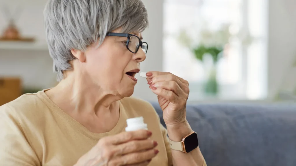 Fashionable joint complement glucosamine connected to quicker Alzheimer’s development senior woman taking vitamin supplement medication pill.webp.webp